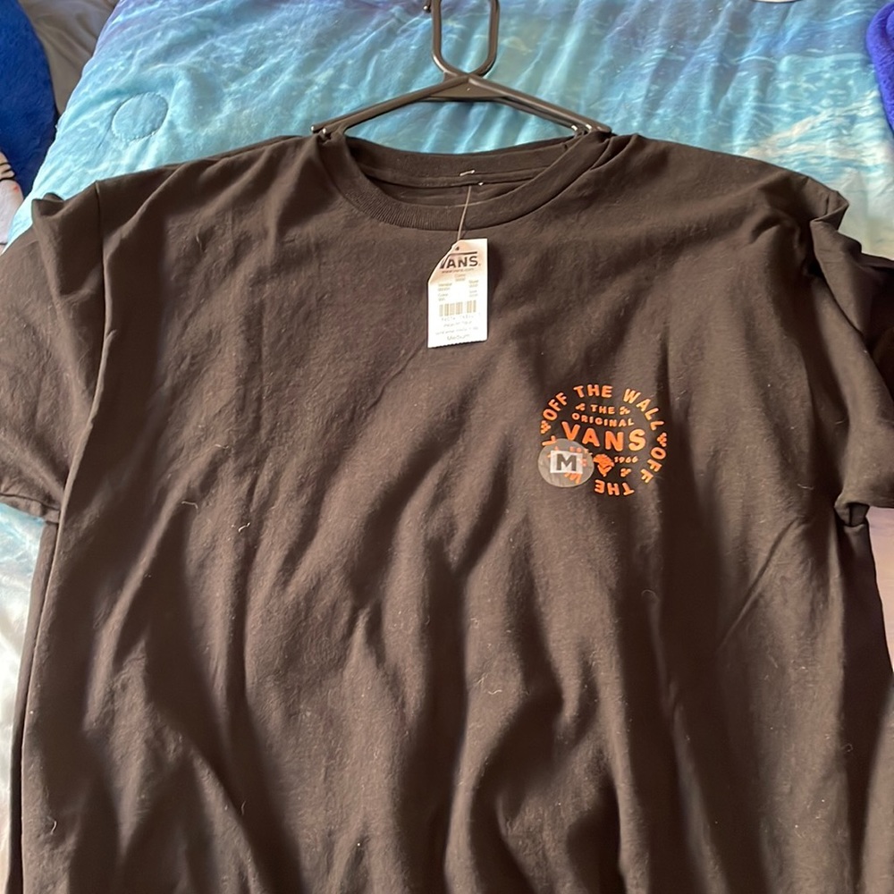 2 medium sized vans shirts